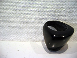 Smooth, round, blubous, and very comfortable. Beautiful wooden ring by a Haitian artist.